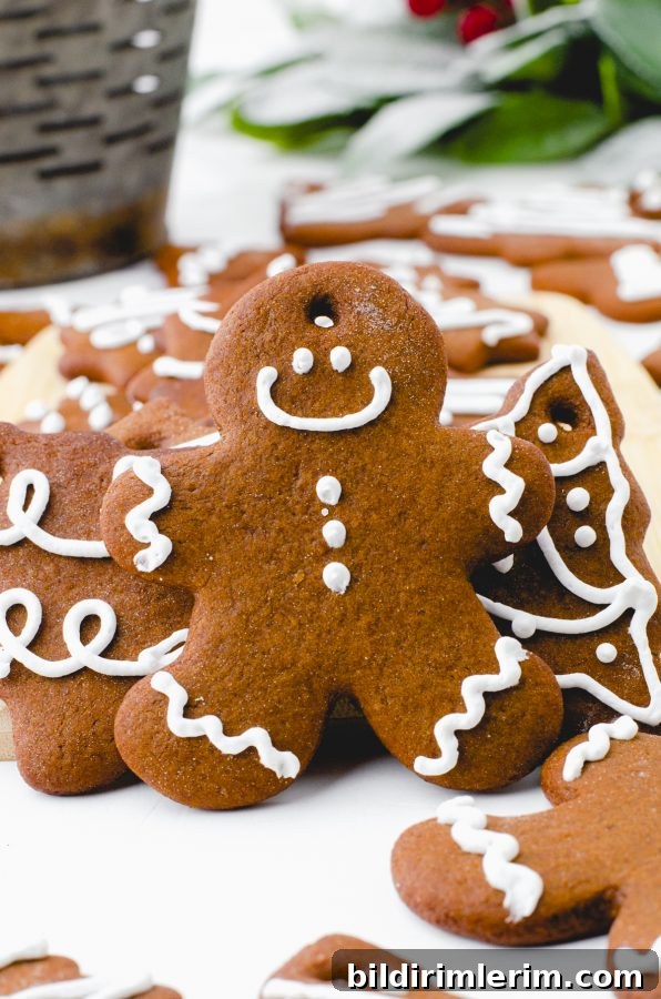 A gingerbread man cookie decorated with a smiley face.
