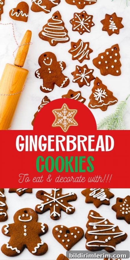 Gingerbread cookies decorated with a rolling pin beside.