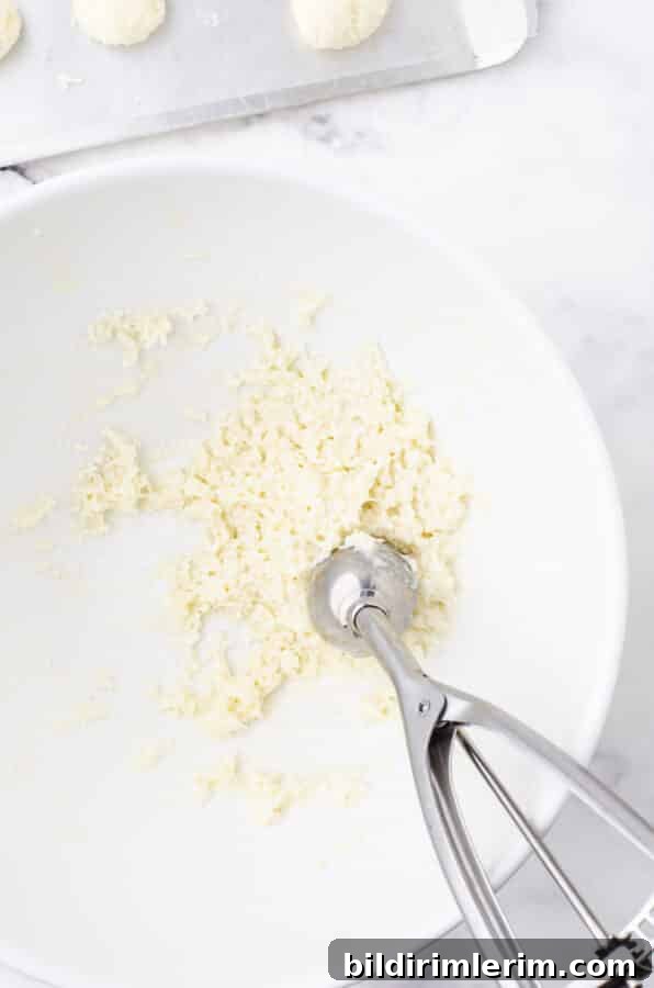 No-Bake Coconut Bliss Balls Recipe 3 No bake coconut balls batter in a bowl