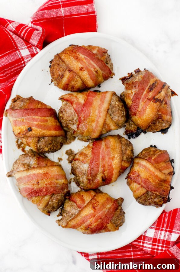 A platter of bacon wrapped mini meatloaf