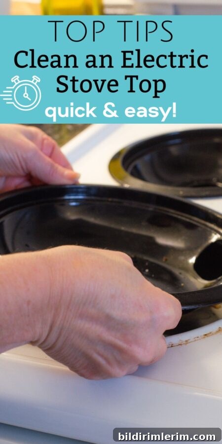 A woman cleaning an electric coil stovetop.