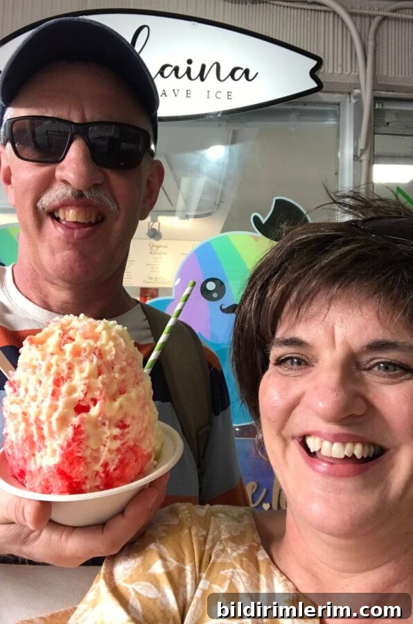 A couple holding a bowl of shave ice in waikiki