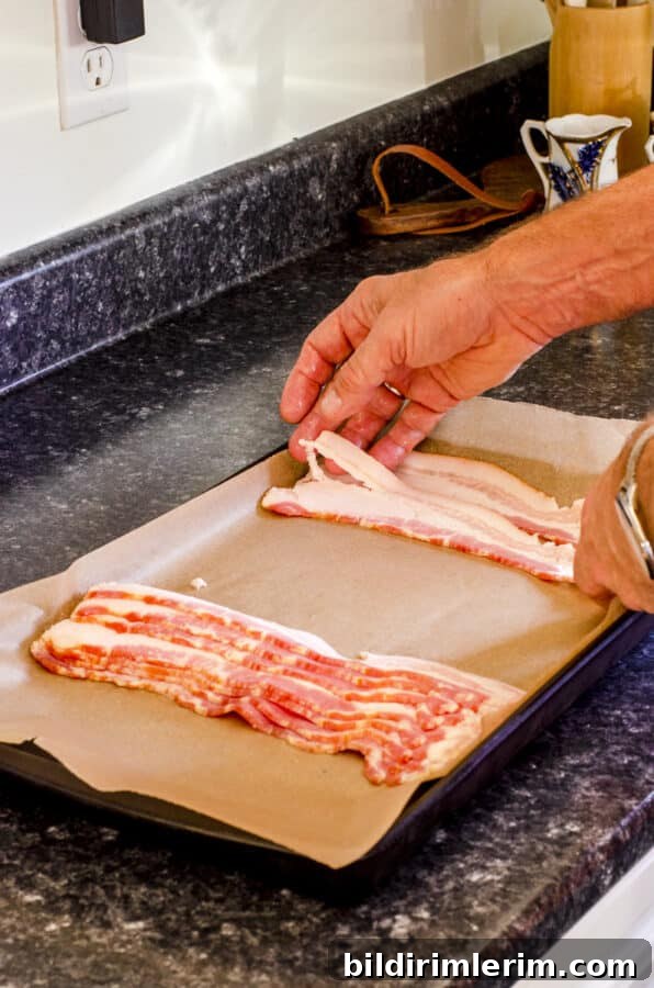 How to Make Crispy Bacon in the Oven Every Time 4 Lay bacon strips on parchment lined pan.