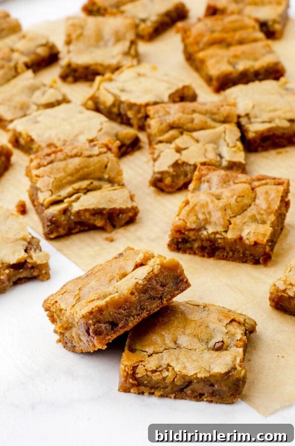 Soft, Chewy Butterscotch Blondies Recipe 10 chewy butterscotch brownie blondies stacked up and other squares of brownies behind