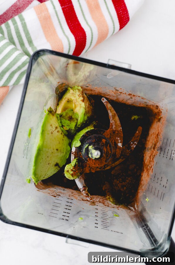 chocolate avocado pudding ingredients in a blender ready to be mixed up