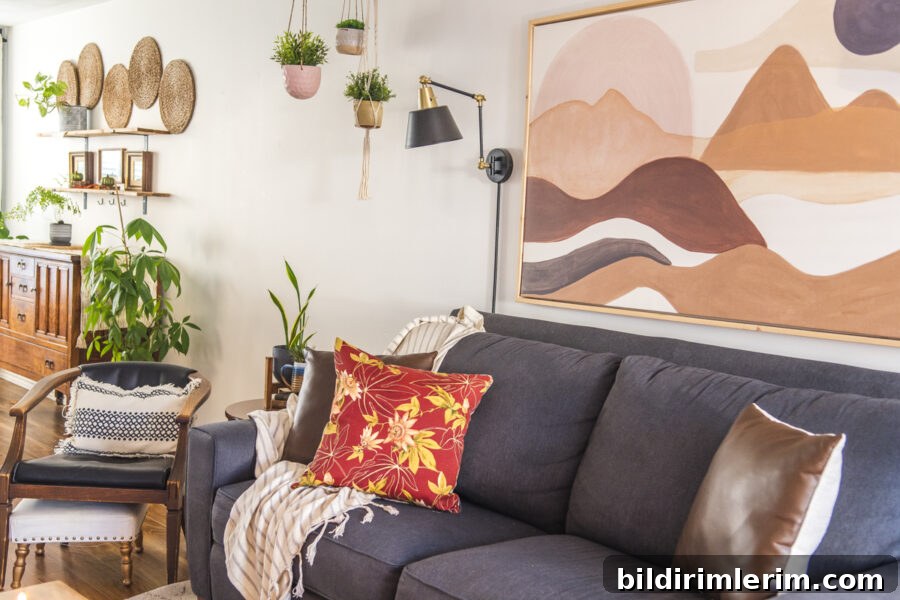 a living room with a boho art print above the couch