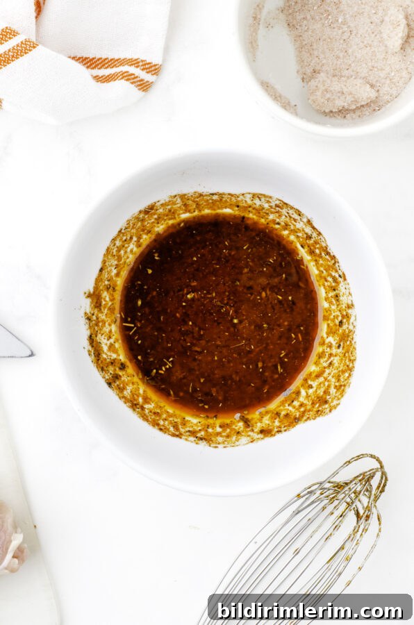 Mexican chicken marinade ingredients stirred together in a bowl.