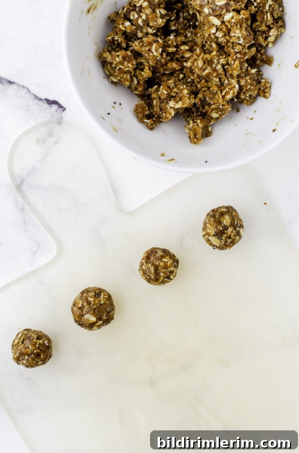 Date balls rolled into balls and lined up on a cutting board