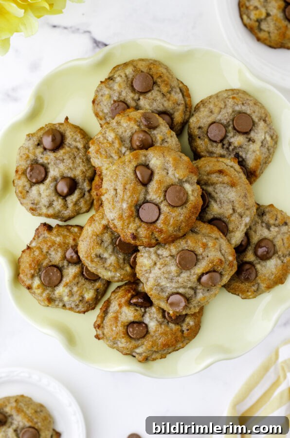 Mini Banana Bread Cookie Bites Recipe 7 Banana Bread cookies with chocolate chips on a yellow platter.