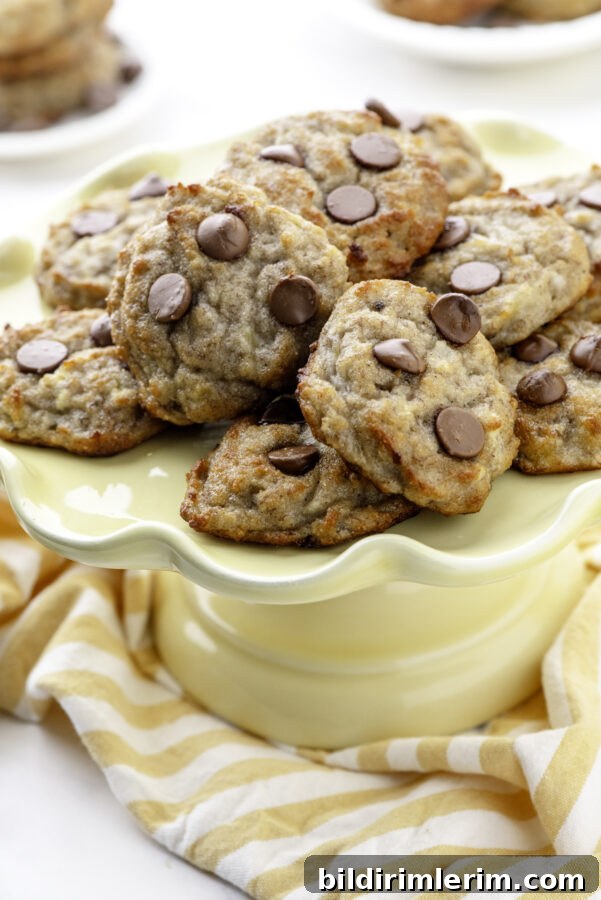 Mini Banana Bread Cookie Bites Recipe 8 A yellow plate with a stack of banana cookies on it.