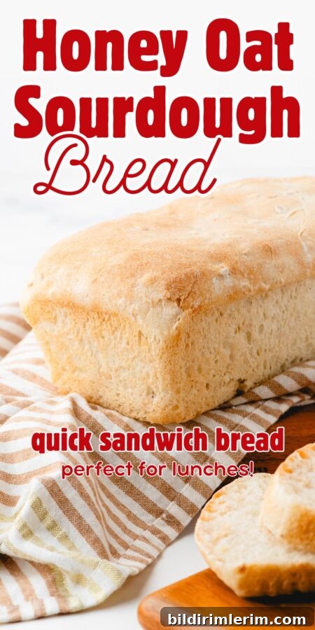 A loaf of sourdough sandwich bread on a striped cloth