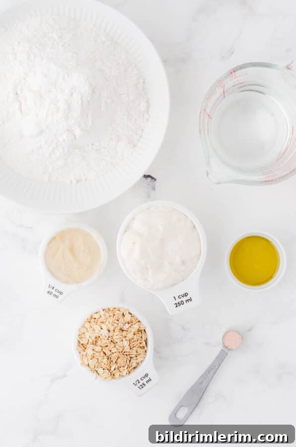 Ingredients for honey oat sourdough sandwich bread
