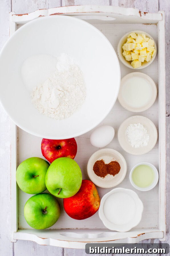Old-Fashioned Apple Cobbler: Classic From-Scratch Recipe 3 Ingredients for this apple cobbler recipe in a large wooden tray.