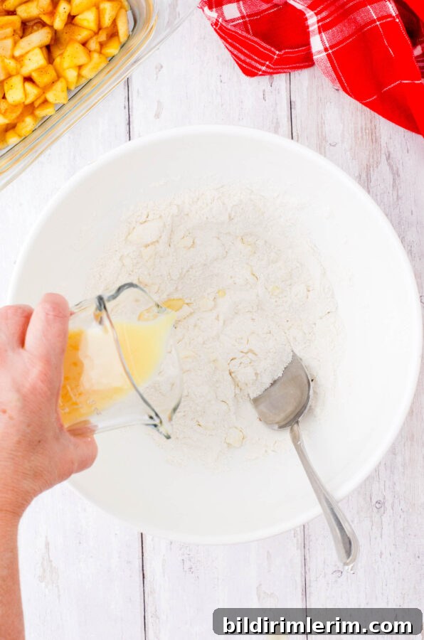 Old-Fashioned Apple Cobbler: Classic From-Scratch Recipe 7 Adding milk and egg to the topping