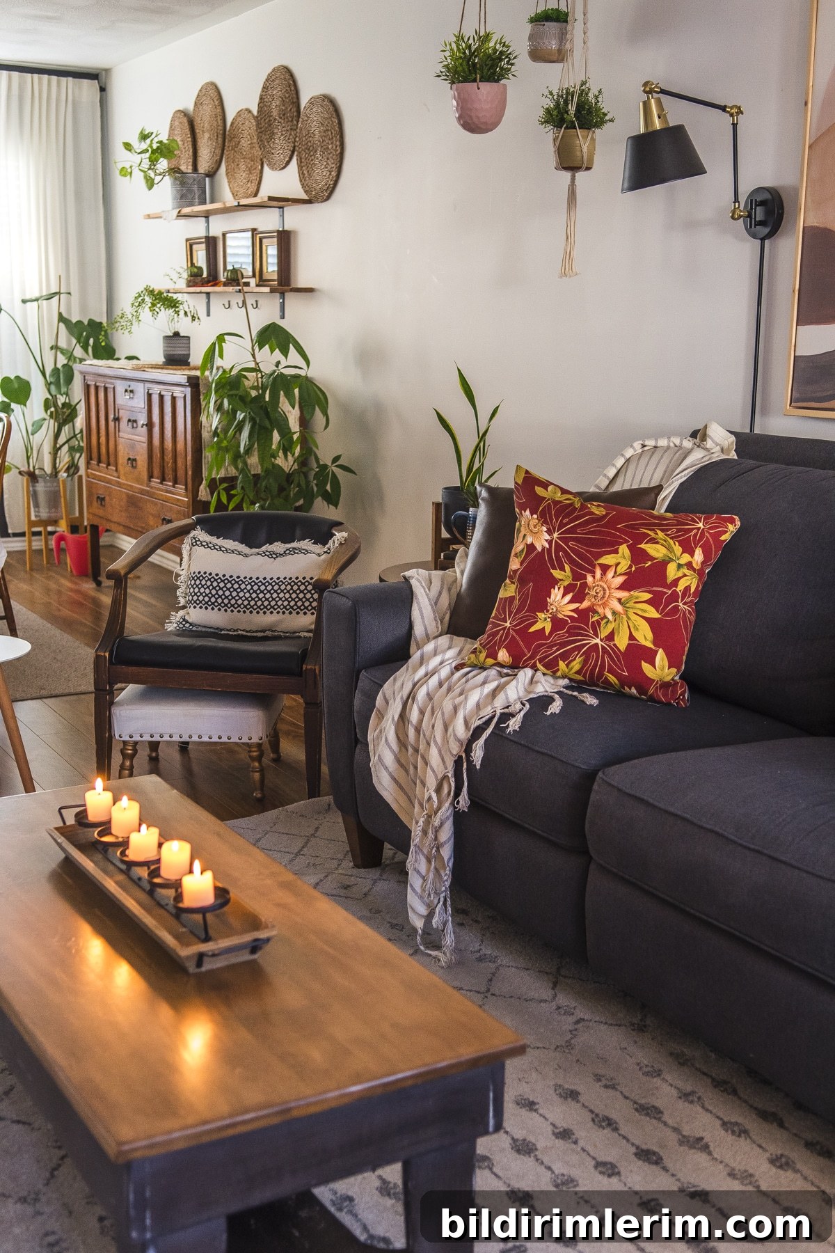 Candles lit on a coffee table next to a couch