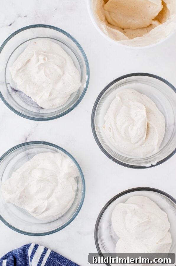 Make-Ahead Yogurt Bowls for Quick Grab-and-Go Breakfasts 4 4 clear glass bowls with a serving of greek yogurt in each bowl.