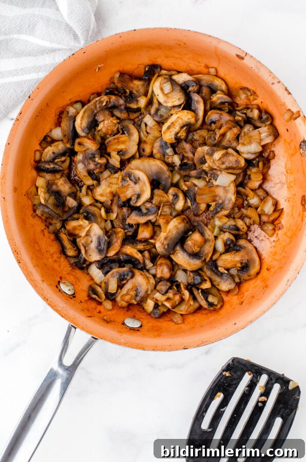 Sautéed mushrooms and onions in a saucepan