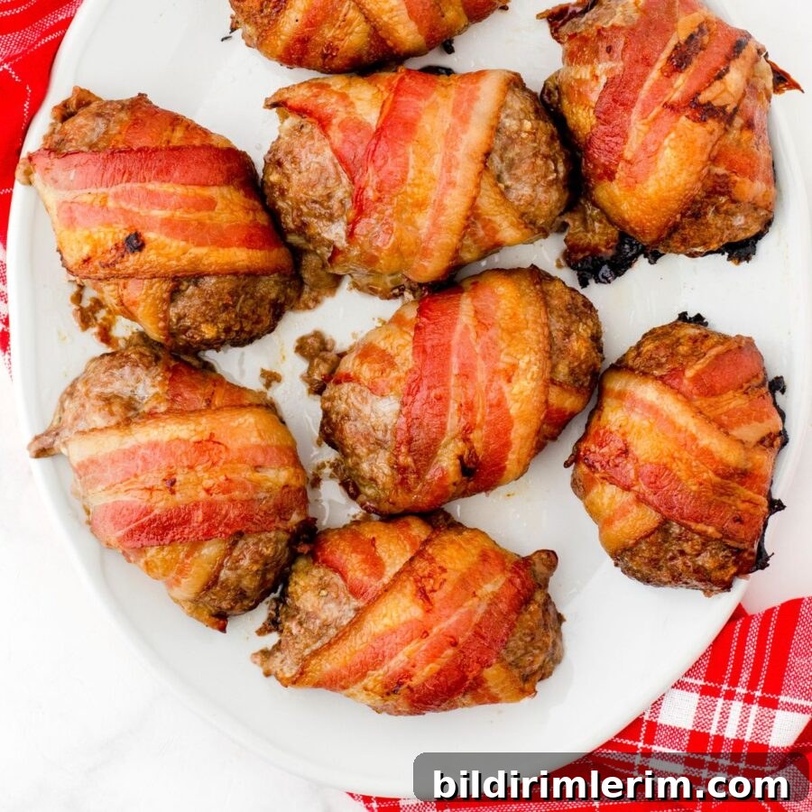 A platter of bacon wrapped mini meatloaf