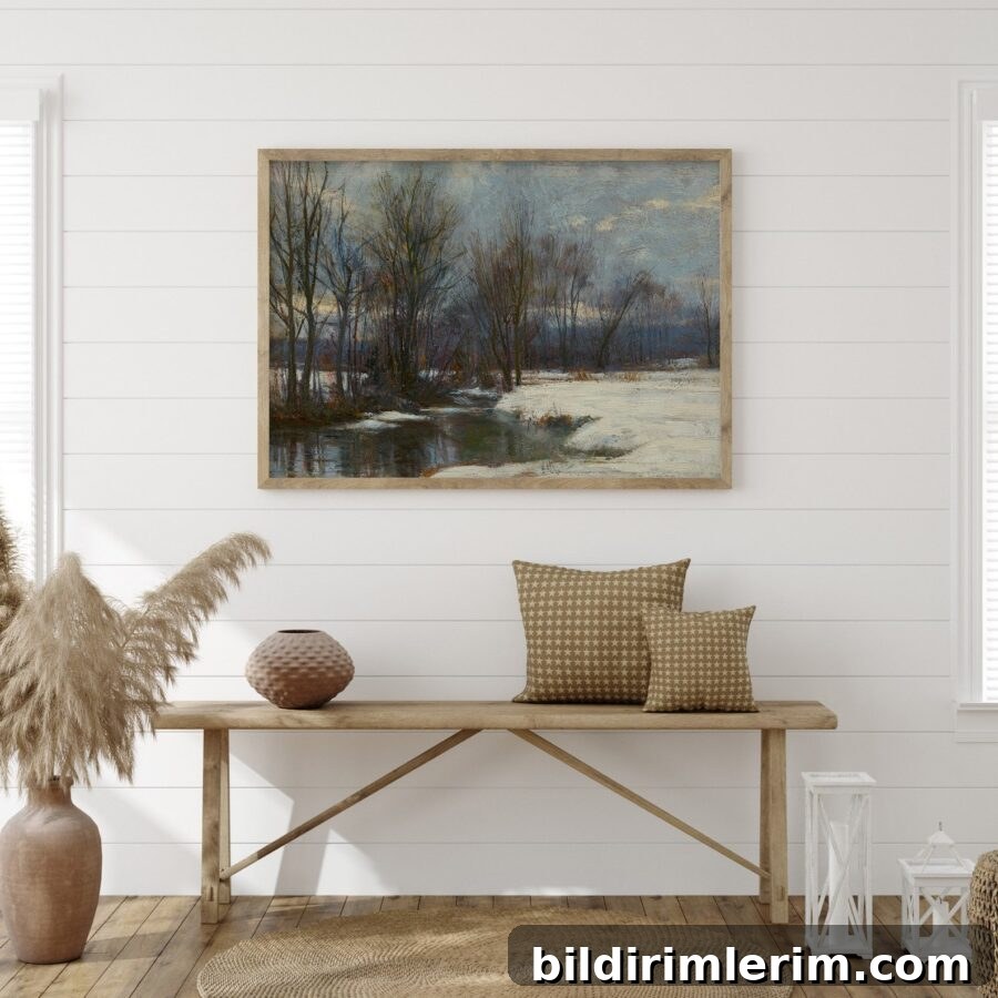 Vintage wall art print of Winter Landscape oil painting from 1800s hanging on a wall above a bench