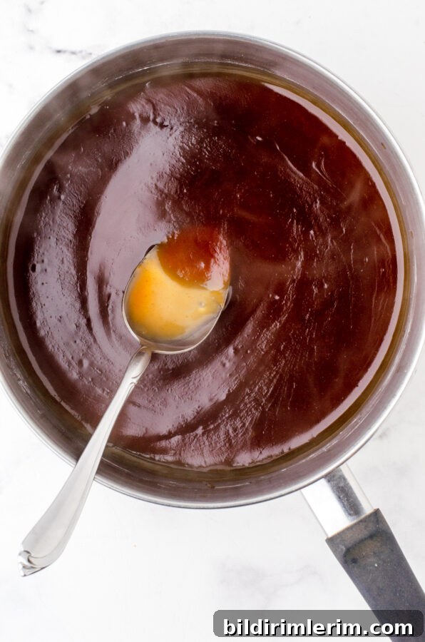 Waikiki Sweet and Sour Meatball Recipe with Pineapple Tidbits 6 Sauce thickening and darkening as it cooks