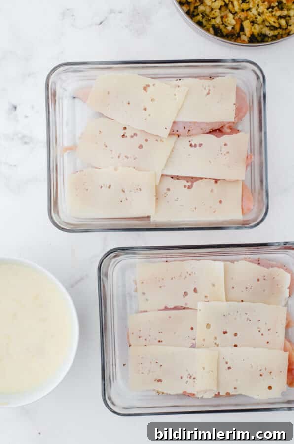 Swiss Chicken Casserole with Savory Stuffing 4 Swiss cheese layered on chicken breasts