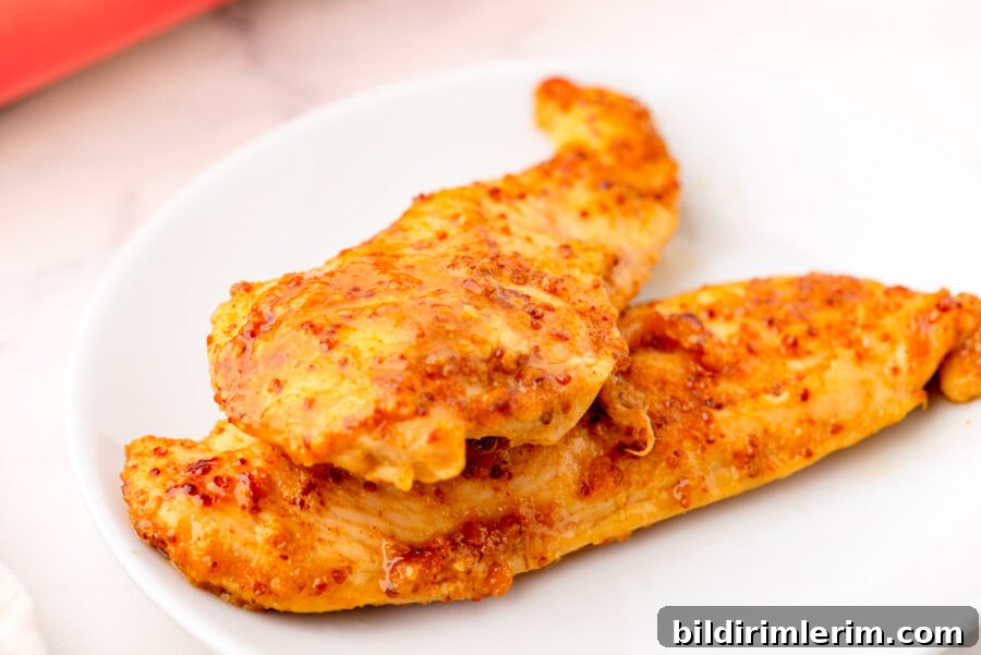 Honey mustard chicken breasts on a serving plate.
