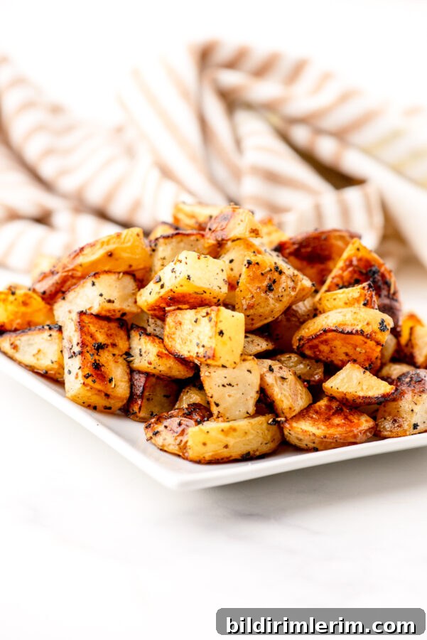 Crispy Oven-Roasted Diced Potatoes Recipe 7 Roasted Diced potatoes on a plate.