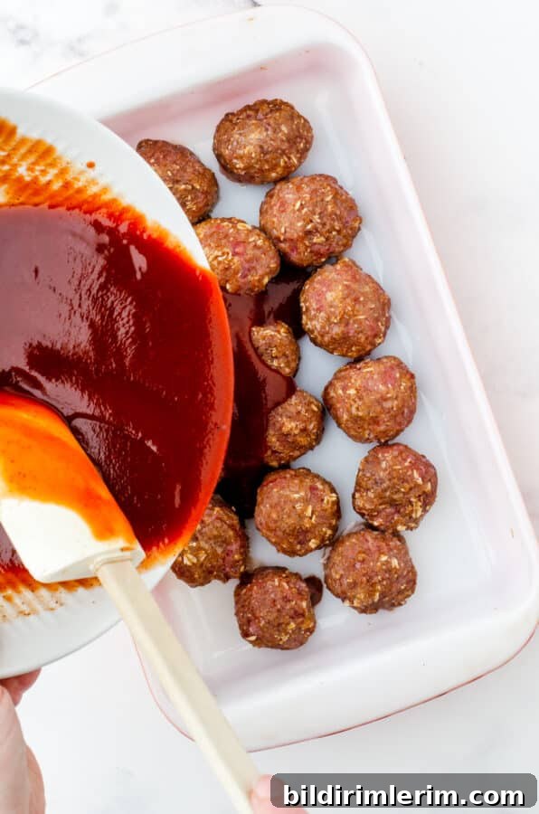 Barbecue meatball sauce served with meatballs.