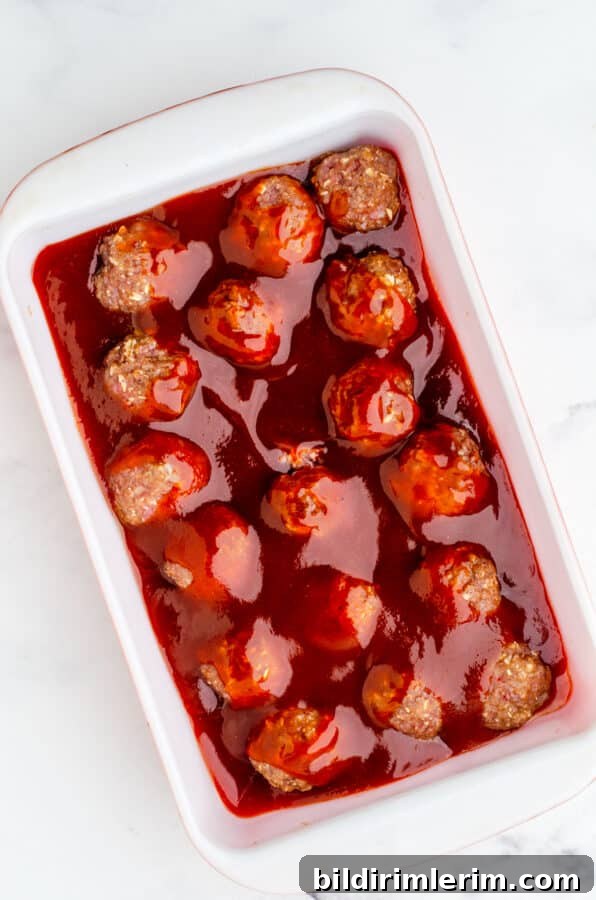 Homemade barbecue meatballs sauce poured over meatballs.