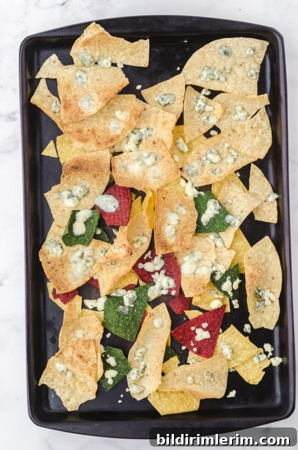 Broil nachos until cheese melts