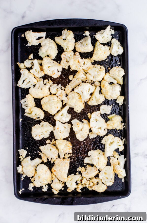 Toss cauliflower florets in olive oil and spices.