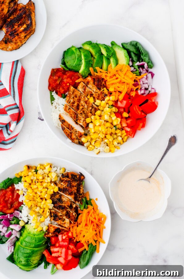 Build Your Own Mexican Chicken Rice Bowls Recipe 4 2 bowls of mexican chicken rice bowl with sauce beside