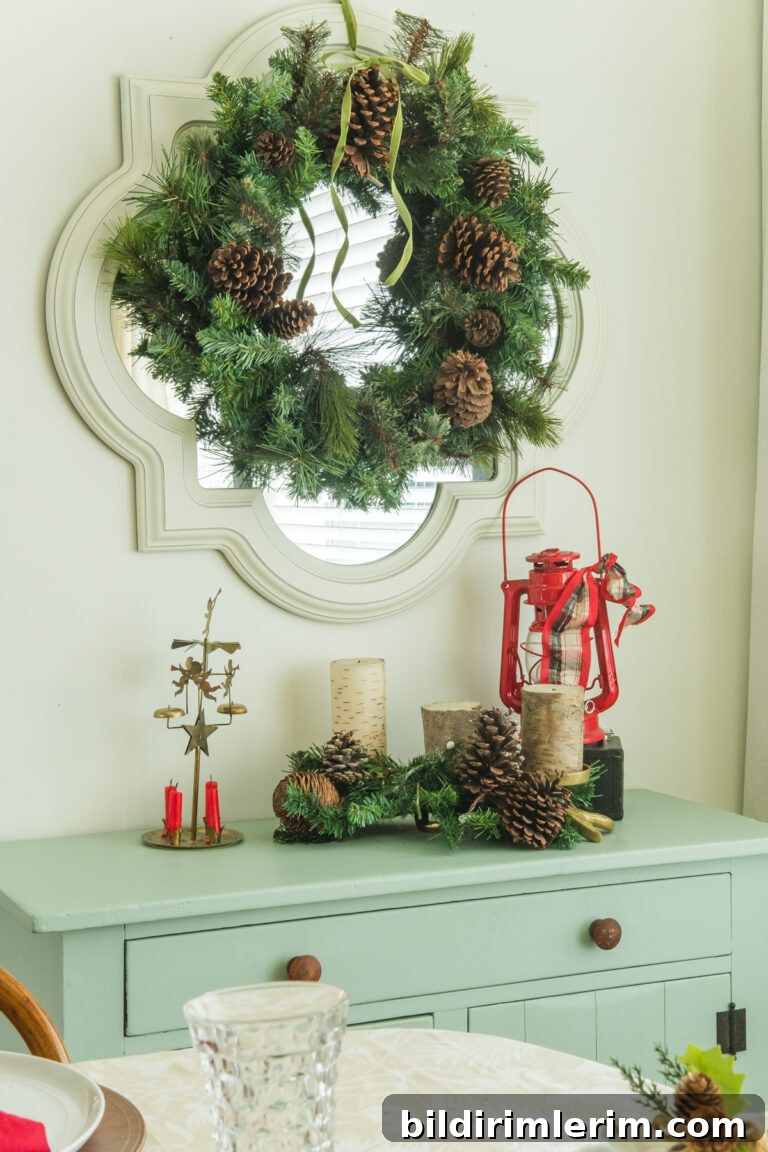 A small antique dresser styled with a Christmas vignette