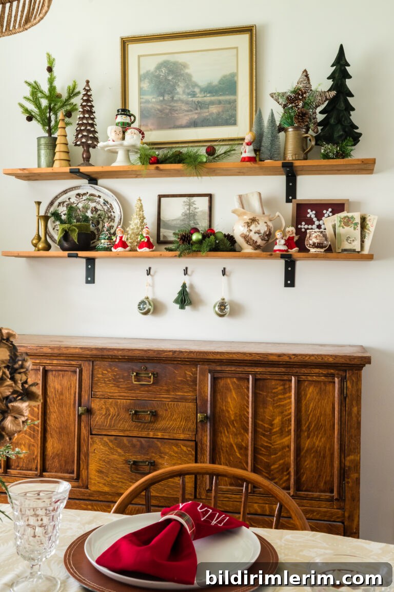 Shelves above an antique buffet styled with Christmas decor