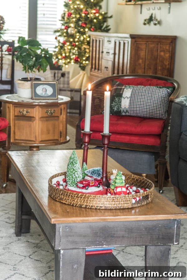 Christmas coffee table decor with a red chair behind