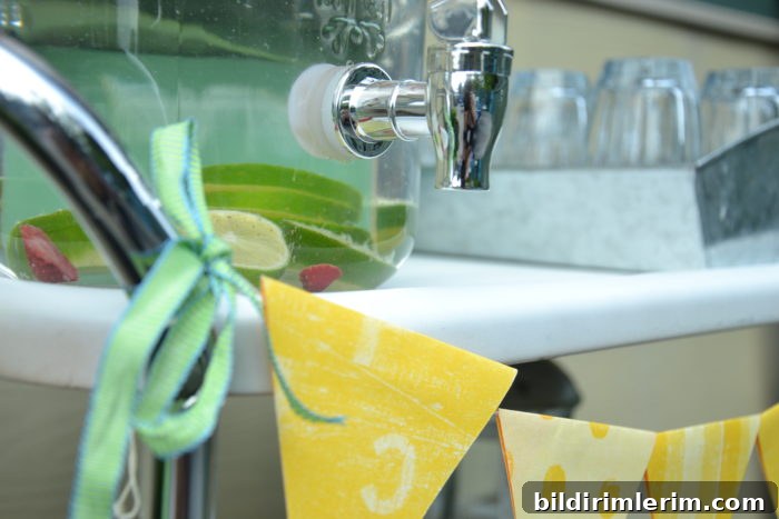 DIY Paint Rusty Metal: Weekend Vintage Cart Makeover 5 The top of a 3 tier metal rolling cart with a jug of ice water and tray of glasses on the top