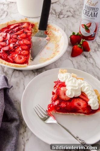 Strawberry Jello Pie Recipe with Grandma's No-Roll Crust 13 Slice of strawberry pie with whipped cream.