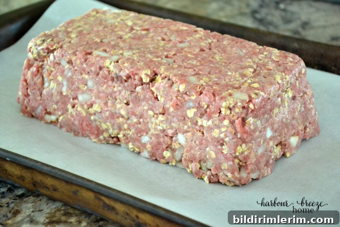 Mealoaf formed on a parchment lined baking sheet