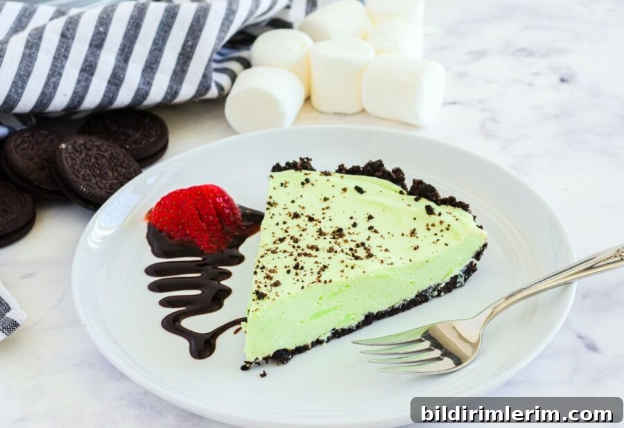 A slice of grasshopper pie on a dessert plate.