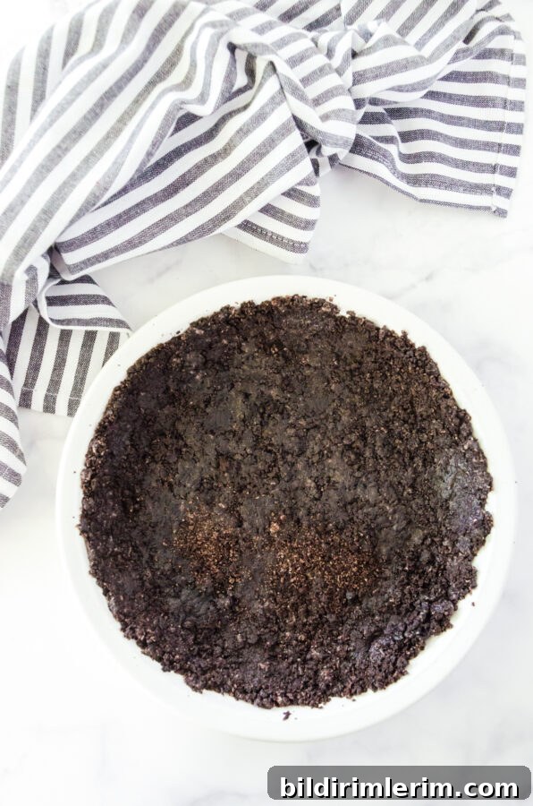 oreo crust pressed into a pan pan